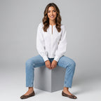 Professional e-commerce fashion photography — create a realistic product-on-model shot using the provided reference images. You are given 5 images: image 1 = product reference, image 2 = product reference, image 3 = product reference, image 4 = product reference, image 5 = model reference. Dress the model from the fifth image in the product from the product images (images 1, 2, 3, 4). The product must be physically placed on the model's body — worn naturally with correct fit, draping, and proportions as it