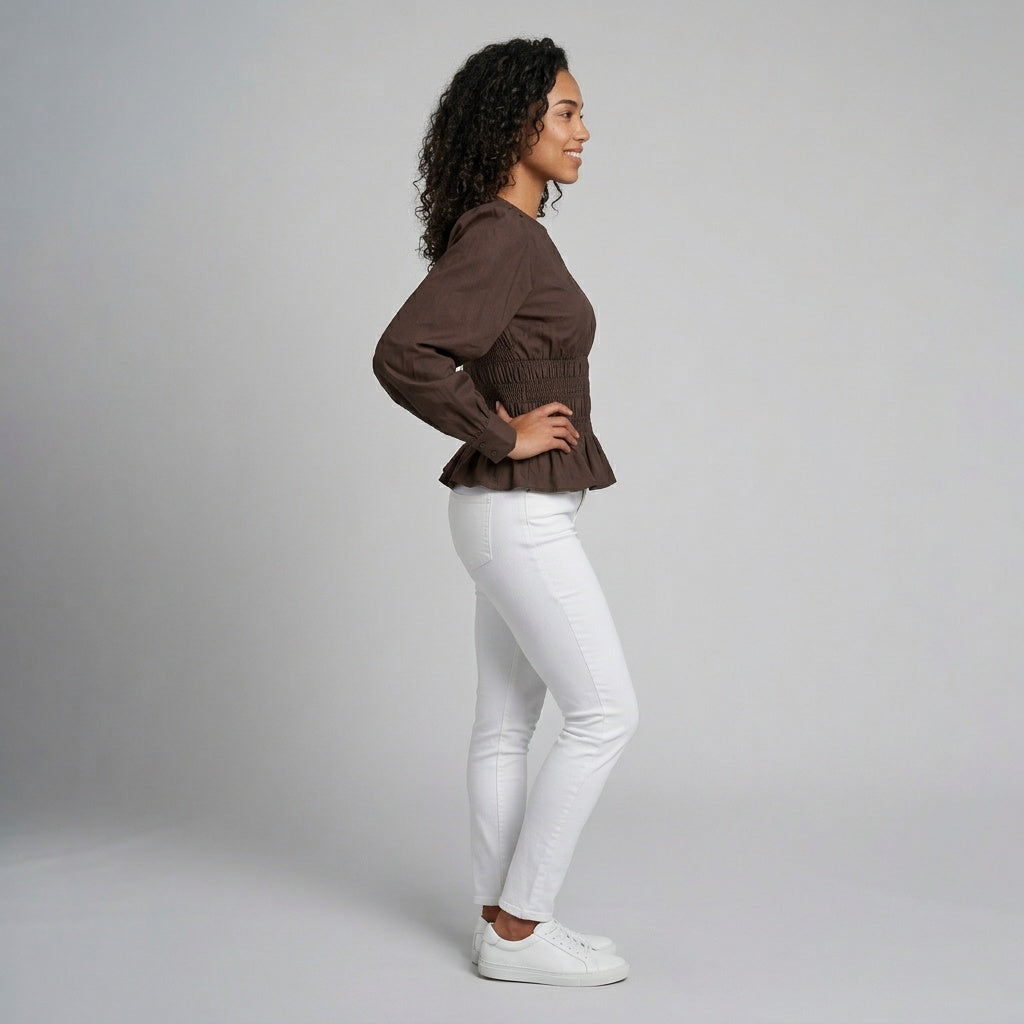 Professional e-commerce fashion photography — create a realistic product-on-model shot using the provided reference images. You are given 2 images: image 1 = product reference, image 2 = model reference. Dress the model from the second image in the product from the first image. The product must be physically placed on the model's body — worn naturally with correct fit, draping, and proportions as it would appear in real life. The product is the hero of the shot and must be clearly visible, prominently displ