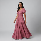 Professional e-commerce fashion photography — create a realistic product-on-model shot using the provided reference images. You are given 2 images: image 1 = product reference, image 2 = model reference. Dress the model from the second image in the product from the first image. The product must be physically placed on the model's body — worn naturally with correct fit, draping, and proportions as it would appear in real life. The product is the hero of the shot and must be clearly visible, prominently displ