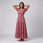 Professional e-commerce fashion photography — create a realistic product-on-model shot using the provided reference images. You are given 2 images: image 1 = product reference, image 2 = model reference. Dress the model from the second image in the product from the first image. The product must be physically placed on the model's body — worn naturally with correct fit, draping, and proportions as it would appear in real life. The product is the hero of the shot and must be clearly visible, prominently displ
