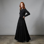 Professional e-commerce fashion photography — create a realistic product-on-model shot using the provided reference images. You are given 2 images: image 1 = product reference, image 2 = model reference. Dress the model from the second image in the product from the first image. The product must be physically placed on the model's body — worn naturally with correct fit, draping, and proportions as it would appear in real life. The product is the hero of the shot and must be clearly visible, prominently displ