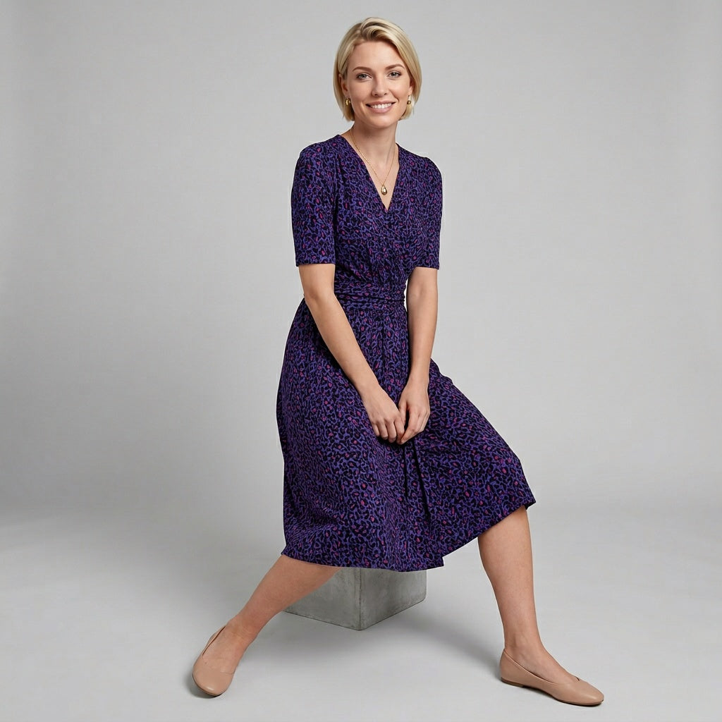 Professional e-commerce fashion photography — create a realistic product-on-model shot using the provided reference images. You are given 2 images: image 1 = product reference, image 2 = model reference. Dress the model from the second image in the product from the first image. The product must be physically placed on the model's body — worn naturally with correct fit, draping, and proportions as it would appear in real life. The product is the hero of the shot and must be clearly visible, prominently displ
