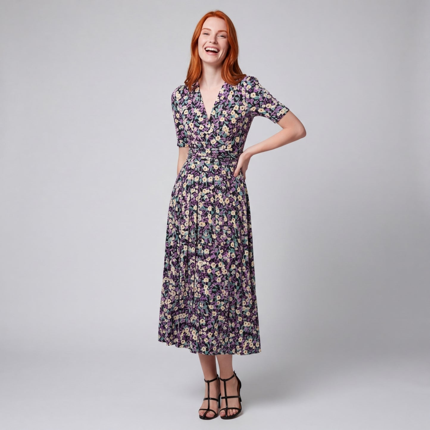 Professional e-commerce fashion photography — create a realistic product-on-model shot using the provided reference images. You are given 2 images: image 1 = product reference, image 2 = model reference. Dress the model from the second image in the product from the first image. The product must be physically placed on the model's body — worn naturally with correct fit, draping, and proportions as it would appear in real life. The product is the hero of the shot and must be clearly visible, prominently displ