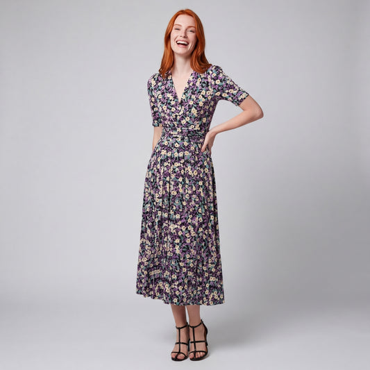 Professional e-commerce fashion photography — create a realistic product-on-model shot using the provided reference images. You are given 2 images: image 1 = product reference, image 2 = model reference. Dress the model from the second image in the product from the first image. The product must be physically placed on the model's body — worn naturally with correct fit, draping, and proportions as it would appear in real life. The product is the hero of the shot and must be clearly visible, prominently displ