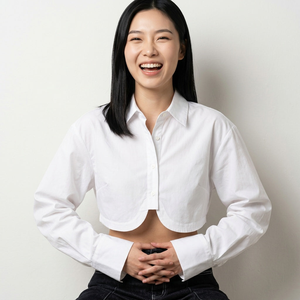 Professional e-commerce fashion photography — create a realistic product-on-model shot using the provided reference images. You are given 2 images: image 1 = product reference, image 2 = model reference. Dress the model from the second image in the product from the first image. The product must be physically placed on the model's body — worn naturally with correct fit, draping, and proportions as it would appear in real life. The product is the hero of the shot and must be clearly visible, prominently displ