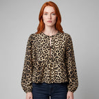 Professional e-commerce fashion photography — create a realistic product-on-model shot using the provided reference images. You are given 2 images: image 1 = product reference, image 2 = model reference. Dress the model from the second image in the product from the first image. The product must be physically placed on the model's body — worn naturally with correct fit, draping, and proportions as it would appear in real life. The product is the hero of the shot and must be clearly visible, prominently displ