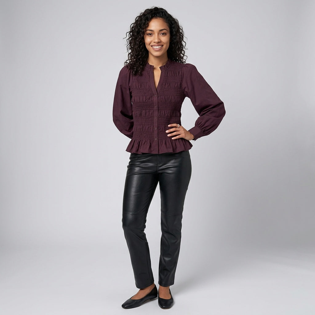 Professional e-commerce fashion photography — create a realistic product-on-model shot using the provided reference images. You are given 2 images: image 1 = product reference, image 2 = model reference. Dress the model from the second image in the product from the first image. The product must be physically placed on the model's body — worn naturally with correct fit, draping, and proportions as it would appear in real life. The product is the hero of the shot and must be clearly visible, prominently displ