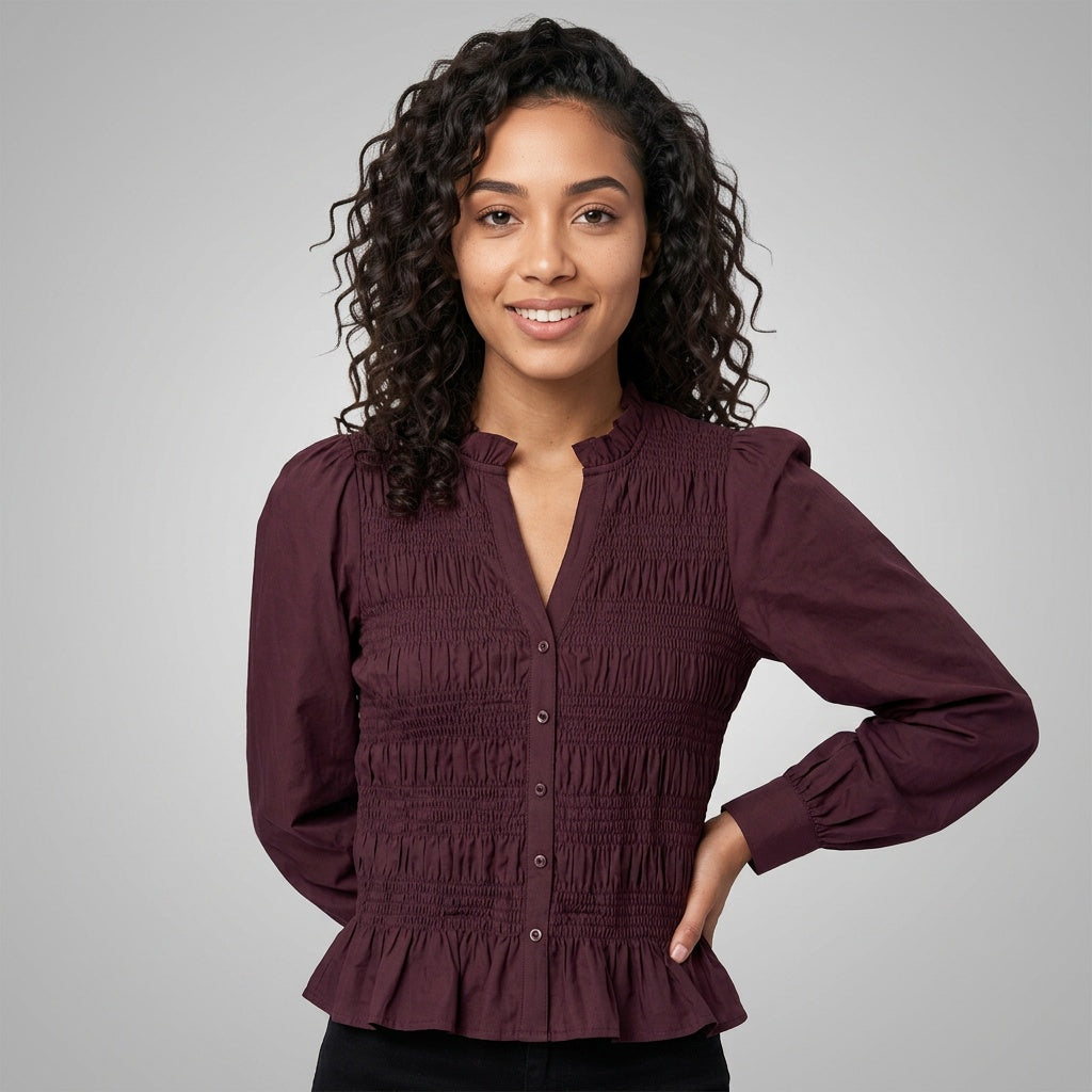 Professional e-commerce fashion photography — create a realistic product-on-model shot using the provided reference images. You are given 2 images: image 1 = product reference, image 2 = model reference. Dress the model from the second image in the product from the first image. The product must be physically placed on the model's body — worn naturally with correct fit, draping, and proportions as it would appear in real life. The product is the hero of the shot and must be clearly visible, prominently displ