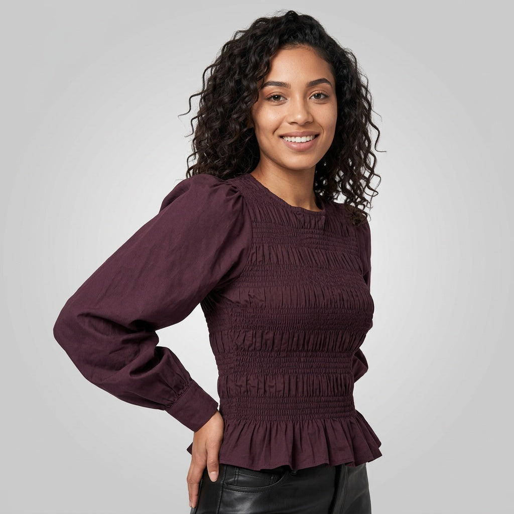 Professional e-commerce fashion photography — create a realistic product-on-model shot using the provided reference images. You are given 2 images: image 1 = product reference, image 2 = model reference. Dress the model from the second image in the product from the first image. The product must be physically placed on the model's body — worn naturally with correct fit, draping, and proportions as it would appear in real life. The product is the hero of the shot and must be clearly visible, prominently displ