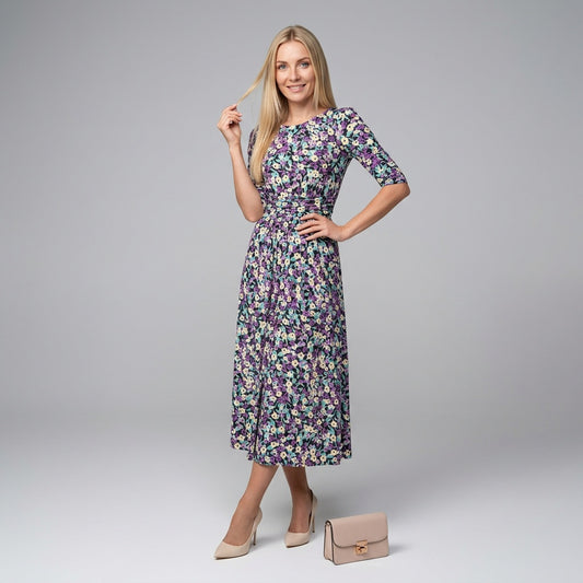 Professional e-commerce fashion photography — create a realistic product-on-model shot using the provided reference images. You are given 2 images: image 1 = product reference, image 2 = model reference. Dress the model from the second image in the product from the first image. The product must be physically placed on the model's body — worn naturally with correct fit, draping, and proportions as it would appear in real life. The product is the hero of the shot and must be clearly visible, prominently displ