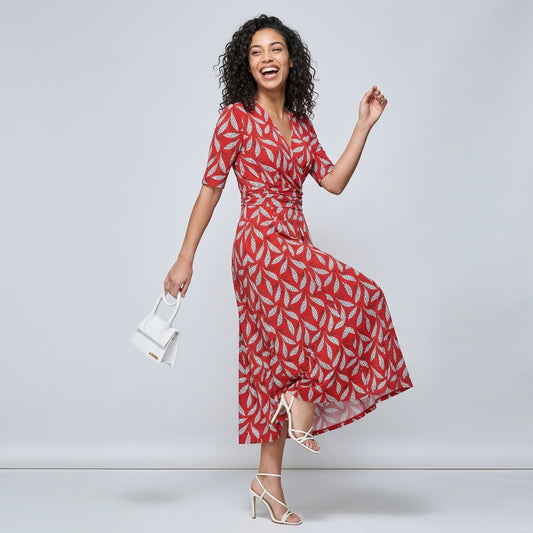 Professional e-commerce fashion photography — create a realistic product-on-model shot using the provided reference images. You are given 2 images: image 1 = product reference, image 2 = model reference. Dress the model from the second image in the product from the first image. The product must be physically placed on the model's body — worn naturally with correct fit, draping, and proportions as it would appear in real life. The product is the hero of the shot and must be clearly visible, prominently displ