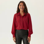Professional e-commerce product photography, edit the provided images. Use the provided image as the product. Preserve the exact product shape, logo, colors, textures, and proportions. Do not alter, reshape, recolor, or add features to the product. upper body shot, waist up, torso and shoulders visible. joyful expressive face, laughing or mid-laugh, candid emotion. standing upright facing forward, arms relaxed at sides, feet together, neutral symmetrical stance. high resolution, commercial quality, sharp fo