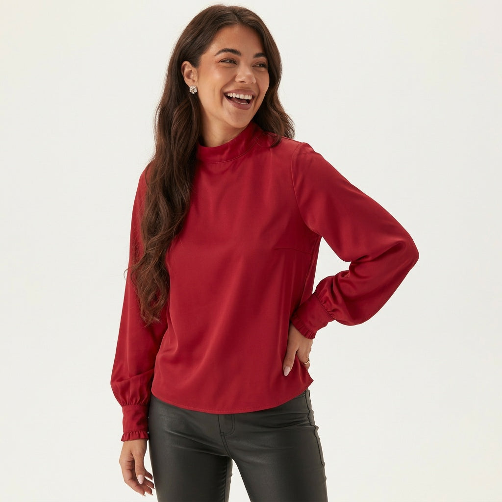 Professional e-commerce product photography, edit the provided images. Use the provided image as the product. Preserve the exact product shape, logo, colors, textures, and proportions. Do not alter, reshape, recolor, or add features to the product. upper body shot, waist up, torso and shoulders visible. joyful expressive face, laughing or mid-laugh, candid emotion. one hand on hip with the other arm behind back, legs close together, slight S-curve posture, confident stance. high resolution, commercial quali