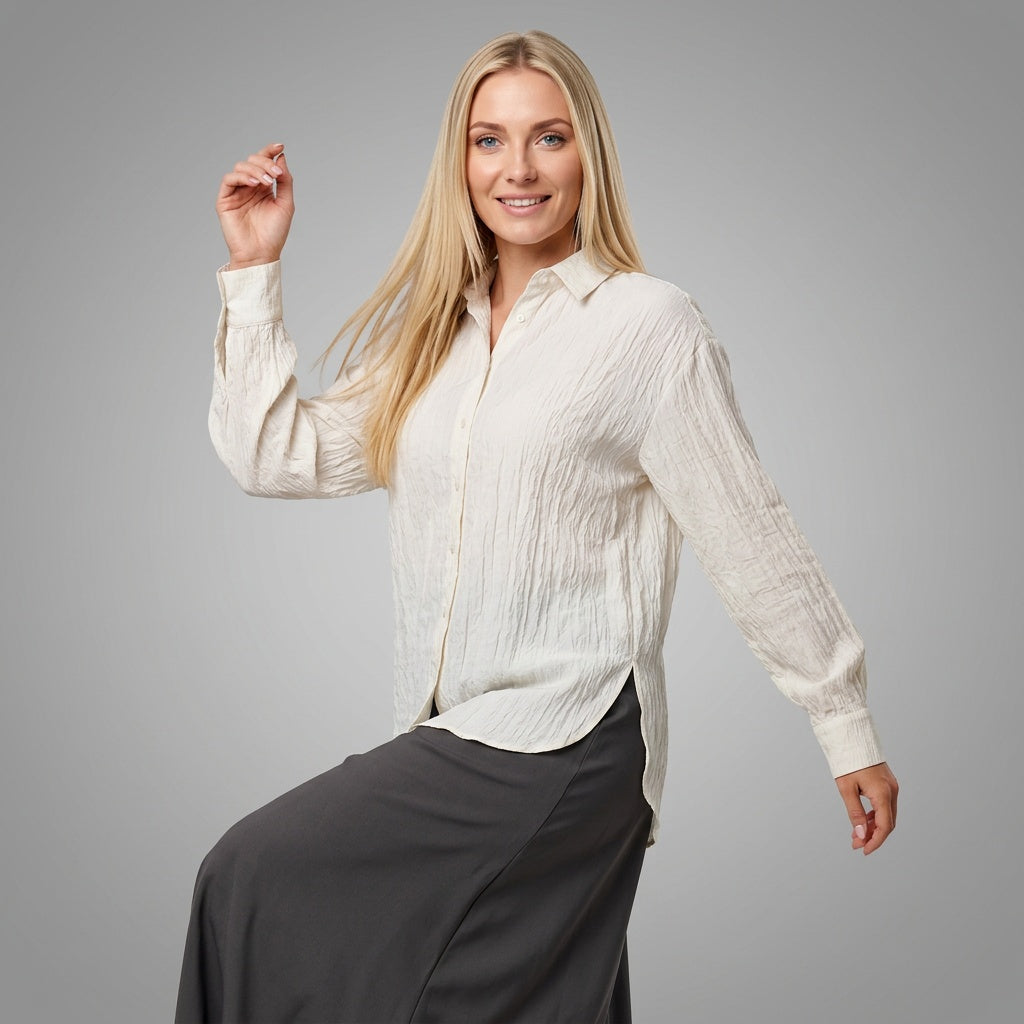 Professional e-commerce fashion photography — create a realistic product-on-model shot using the provided reference images. You are given 2 images: image 1 = product reference, image 2 = model reference. Dress the model from the second image in the product from the first image. The product must be physically placed on the model's body — worn naturally with correct fit, draping, and proportions as it would appear in real life. The product is the hero of the shot and must be clearly visible, prominently displ