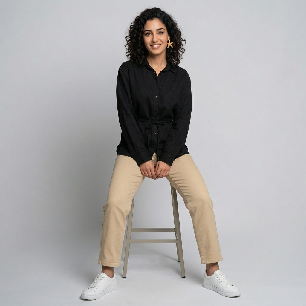 Professional e-commerce fashion photography — create a realistic product-on-model shot using the provided reference images. You are given 2 images: image 1 = product reference, image 2 = model reference. Dress the model from the second image in the product from the first image. The product must be physically placed on the model's body — worn naturally with correct fit, draping, and proportions as it would appear in real life. The product is the hero of the shot and must be clearly visible, prominently displ