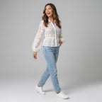 Professional e-commerce fashion photography — create a realistic product-on-model shot using the provided reference images. You are given 2 images: image 1 = product reference, image 2 = model reference. Dress the model from the second image in the product from the first image. The product must be physically placed on the model's body — worn naturally with correct fit, draping, and proportions as it would appear in real life. The product is the hero of the shot and must be clearly visible, prominently displ