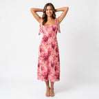 Professional e-commerce fashion photography — create a realistic product-on-model shot using the provided reference images. You are given 2 images: image 1 = product reference, image 2 = model reference. Dress the model from the second image in the product from the first image. The product must be physically placed on the model's body — worn naturally with correct fit, draping, and proportions as it would appear in real life. The product is the hero of the shot and must be clearly visible, prominently displ