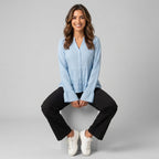 Professional e-commerce fashion photography — create a realistic product-on-model shot using the provided reference images. You are given 5 images: image 1 = product reference, image 2 = product reference, image 3 = product reference, image 4 = product reference, image 5 = model reference. Dress the model from the fifth image in the product from the product images (images 1, 2, 3, 4). The product must be physically placed on the model's body — worn naturally with correct fit, draping, and proportions as it