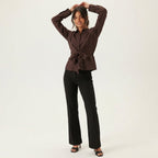 Professional e-commerce product photography, edit the provided images. You are given 4 images: image 1 = product reference, image 2 = product reference, image 3 = product reference, image 4 = product reference. Use the product images (images 1, 2, 3, 4) as the product. Preserve the exact product shape, logo, colors, textures, and proportions. Do not alter, reshape, recolor, or add features to the product. full body shot, head to toe, complete figure visible. natural warm smile, approachable and friendly exp