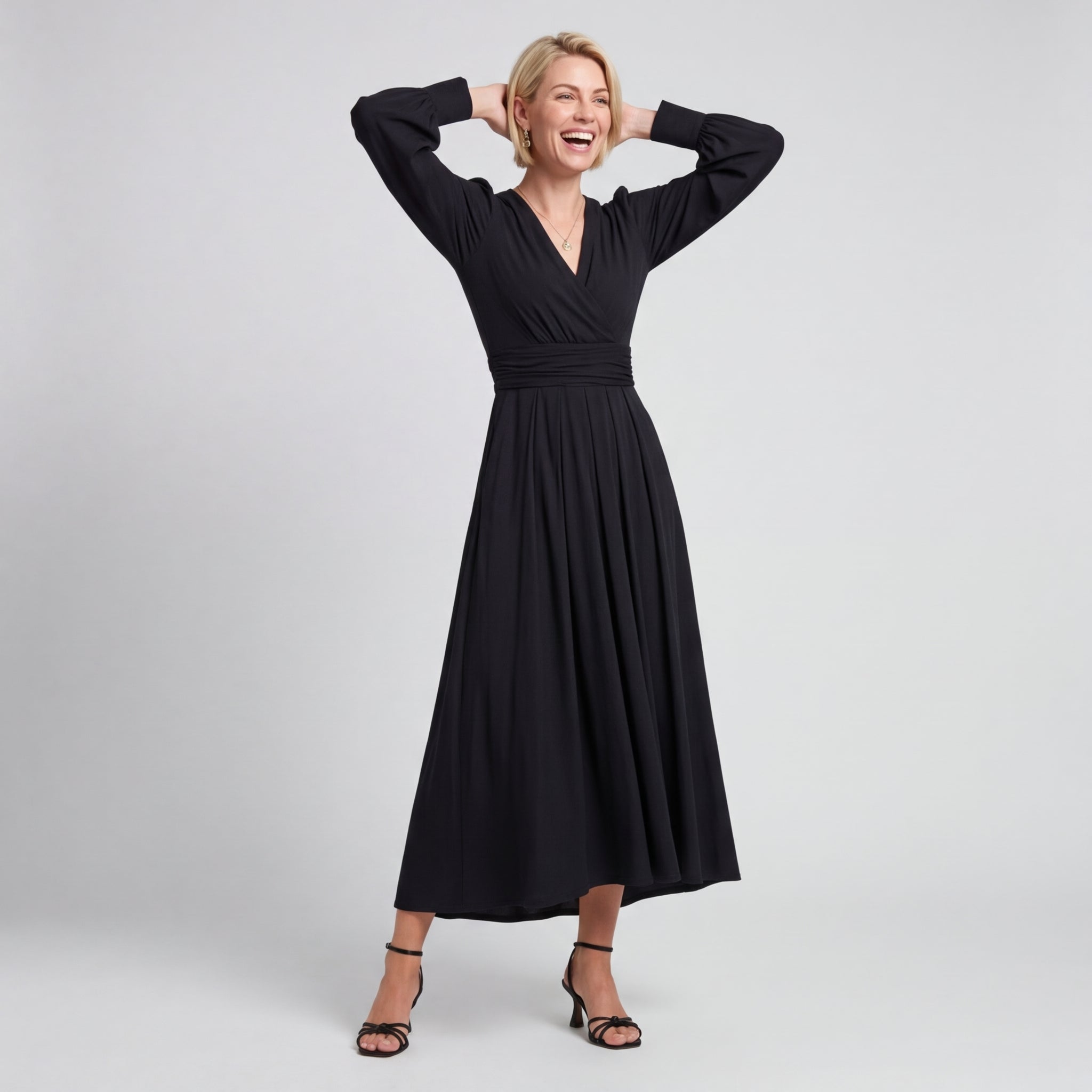 Professional e-commerce fashion photography — create a realistic product-on-model shot using the provided reference images. You are given 2 images: image 1 = product reference, image 2 = model reference. Dress the model from the second image in the product from the first image. The product must be physically placed on the model's body — worn naturally with correct fit, draping, and proportions as it would appear in real life. The product is the hero of the shot and must be clearly visible, prominently displ