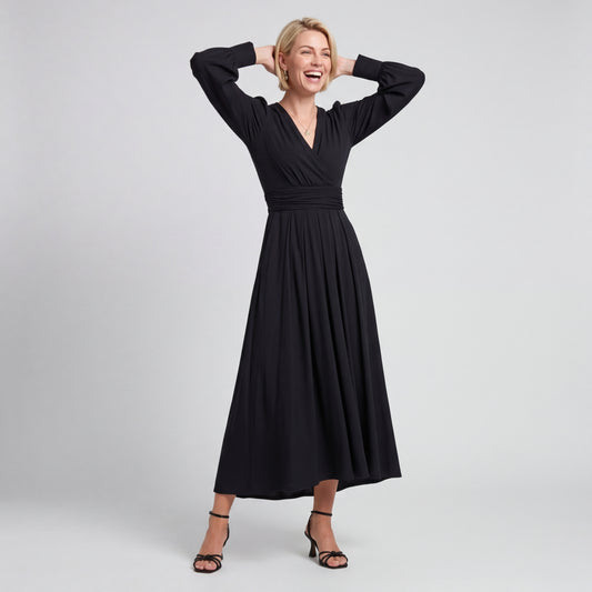 Professional e-commerce fashion photography — create a realistic product-on-model shot using the provided reference images. You are given 2 images: image 1 = product reference, image 2 = model reference. Dress the model from the second image in the product from the first image. The product must be physically placed on the model's body — worn naturally with correct fit, draping, and proportions as it would appear in real life. The product is the hero of the shot and must be clearly visible, prominently displ