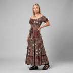 Professional e-commerce fashion photography — create a realistic product-on-model shot using the provided reference images. You are given 2 images: image 1 = product reference, image 2 = model reference. Dress the model from the second image in the product from the first image. The product must be physically placed on the model's body — worn naturally with correct fit, draping, and proportions as it would appear in real life. The product is the hero of the shot and must be clearly visible, prominently displ